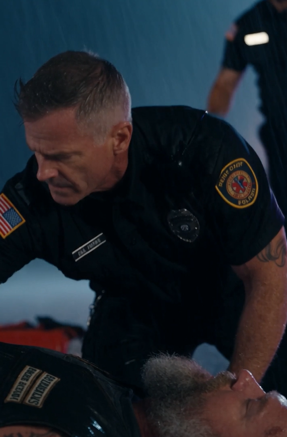 The Five-Year-Old Girl Refused To Release The Dead Biker’s Hand, Even As The Paramedics Tried To Gently Pry Her Away. She Screamed, A Raw, Jagged Sound That Tore Through The Hiss Of Rain And The Crackle Of Police Radios. Her Tiny, Pale Fingers Were Locked Around His Massive, Oil-Stained Knuckles As If She Could Anchor His Soul To The Pavement By Sheer Force Of Will.