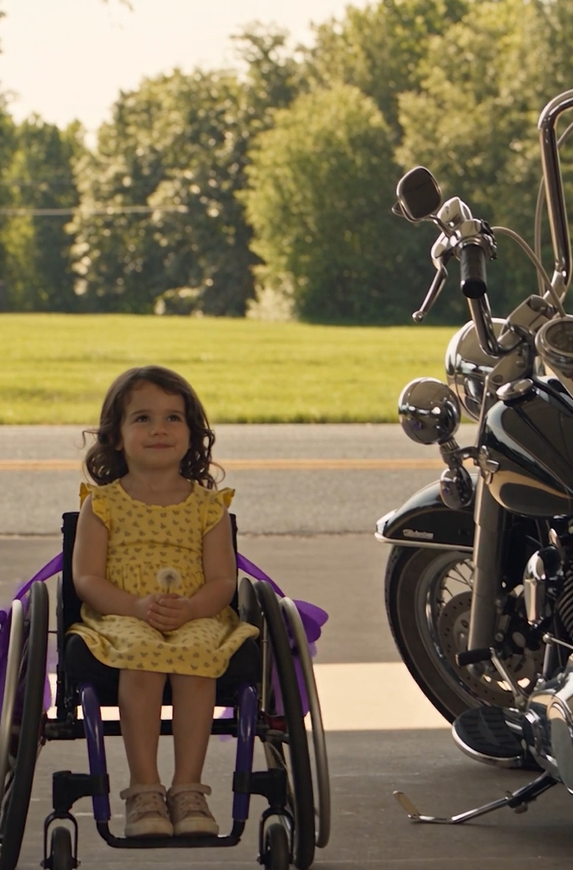 The Morning Air Hung Thick With The Scent Of Freshly Cut Grass And Blooming Jasmine. As 5-Year-Old Emma Martinez Adjusted The Purple Ribbons On Her Wheelchair Wheels, Her Small Hands Were Already Sticky With Dew From The Dandelions She’d Been Collecting Since Sunrise. The Fabric Of Her Favorite Yellow Sundress, The One With Tiny Butterflies That Her Father Had Sent From Afghanistan, Clung To Her Legs In The Humid Heat, And She Could Taste The Sweetness Of Honeysuckle On Her Tongue As She Breathed In The Summer Morning.