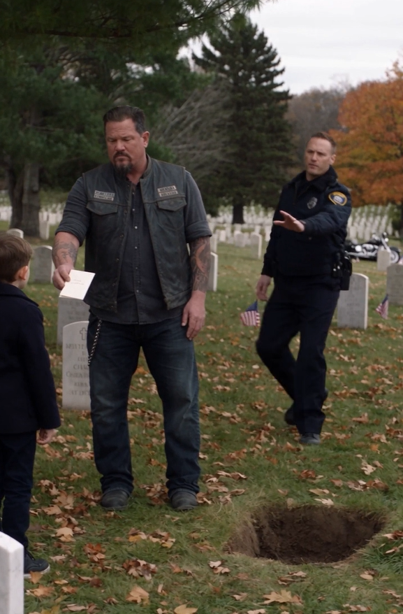 Step Away From The Child!” The Officer Shouted As The Biker Slipped His Hand Inside His Vest. Behind Him, Motorcycle Engines Ticked As They Cooled, And A Little Girl Sobbed On The Porch. Then The Biker Answered Calmly, “We’re Here Because The Court Ordered It.”
